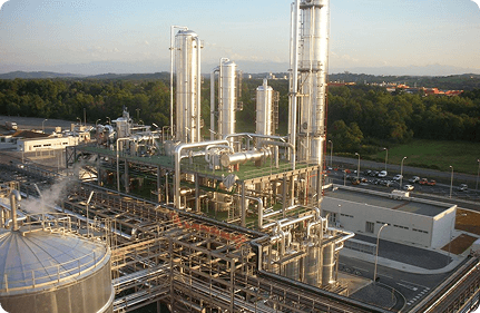 Industrial biodiesel production plant with steel tanks and process piping
