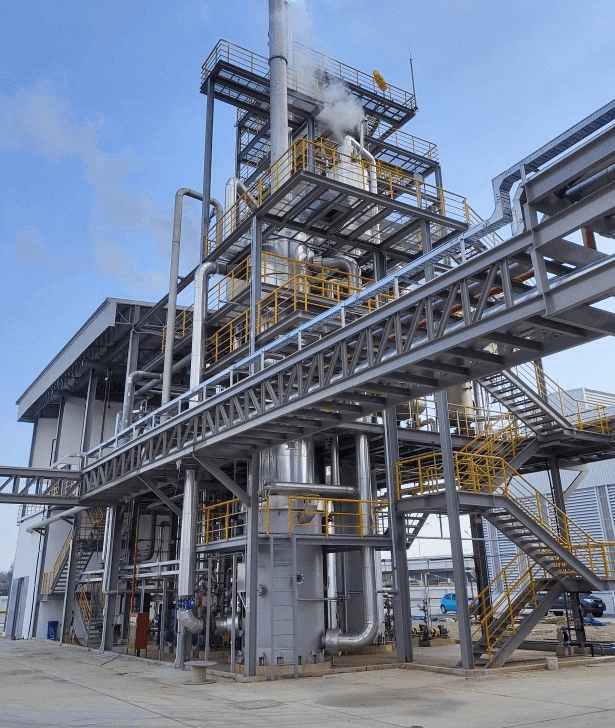 Industrial resin manufacturing plant with reactors and process systems